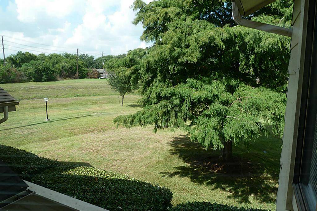 Plenty of green space behind your townhome viewed from the second floor loft area.
