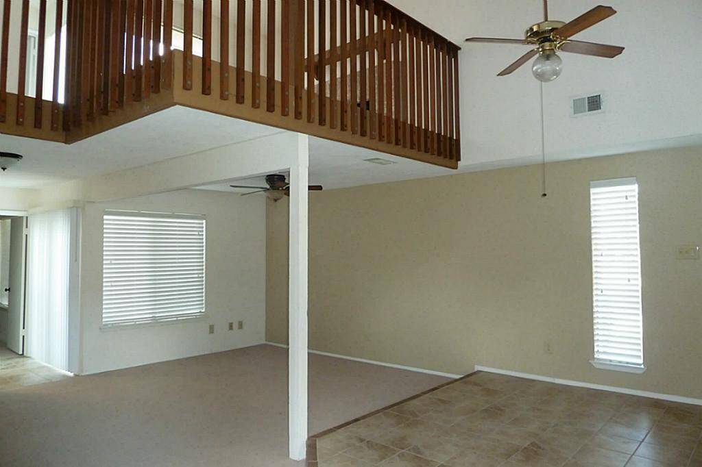 Open floor plan - carpet has been replaced with vinyl wood flooring in living area