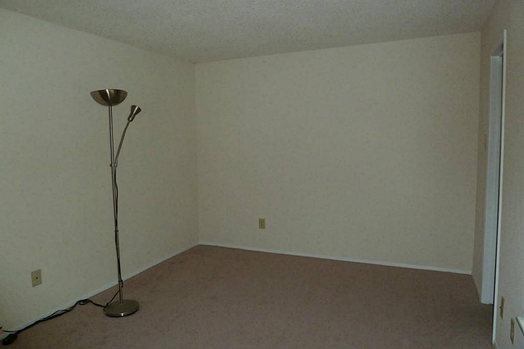First floor bedroom offers wood vinyl flooring (carpet has been replaced) and walk-in closet.