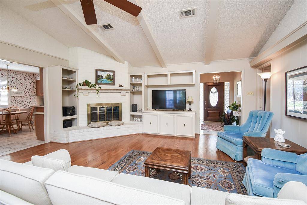 This view shows the front entry on the right and breakfast area on the left