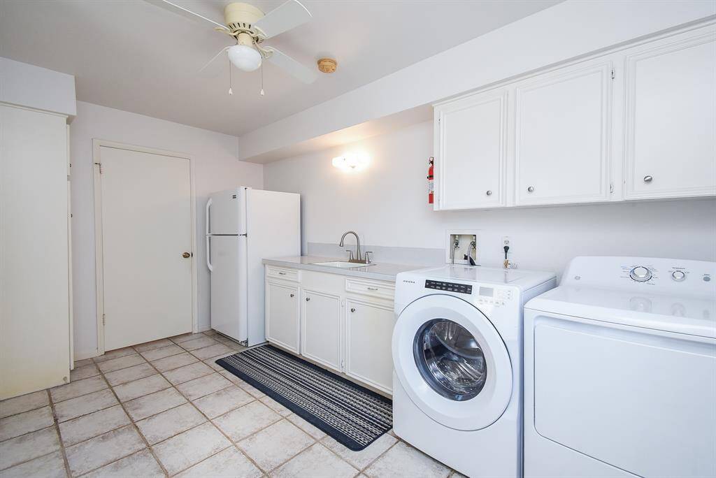 As promised, your really large laundry area complete with a sink and room for 2nd fridge