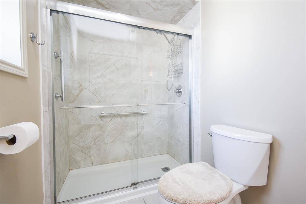 Private water closet with updated walk in shower