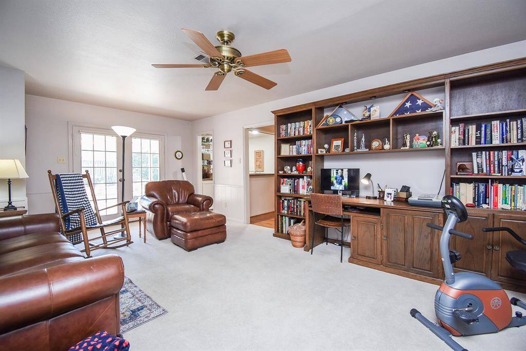 Den with french door access to backyard and covered patio