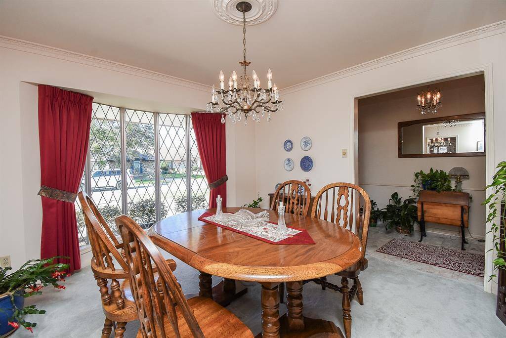 Large picture window in formal dining room allows great natural light