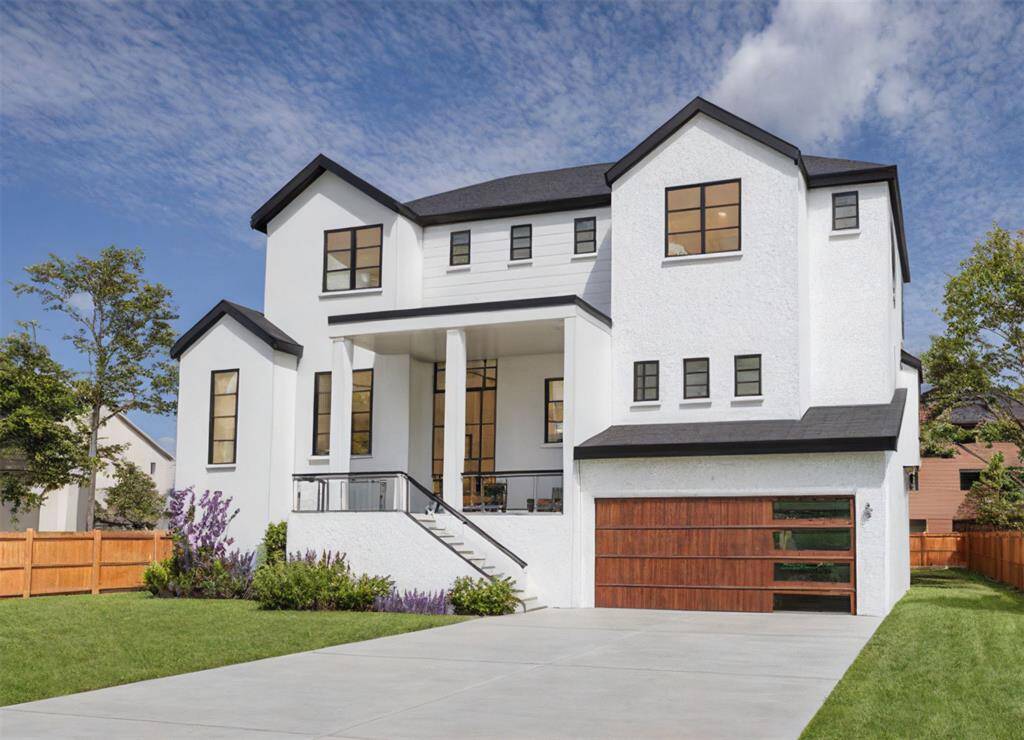 The three car garage offers ample space along with two additional storage rooms beneath the home.