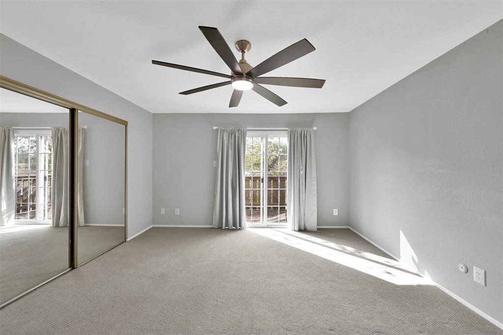 Primary bedroom has a balcony overlooking the backyard which faces South.
