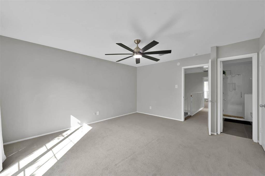 Another view of primary bedroom