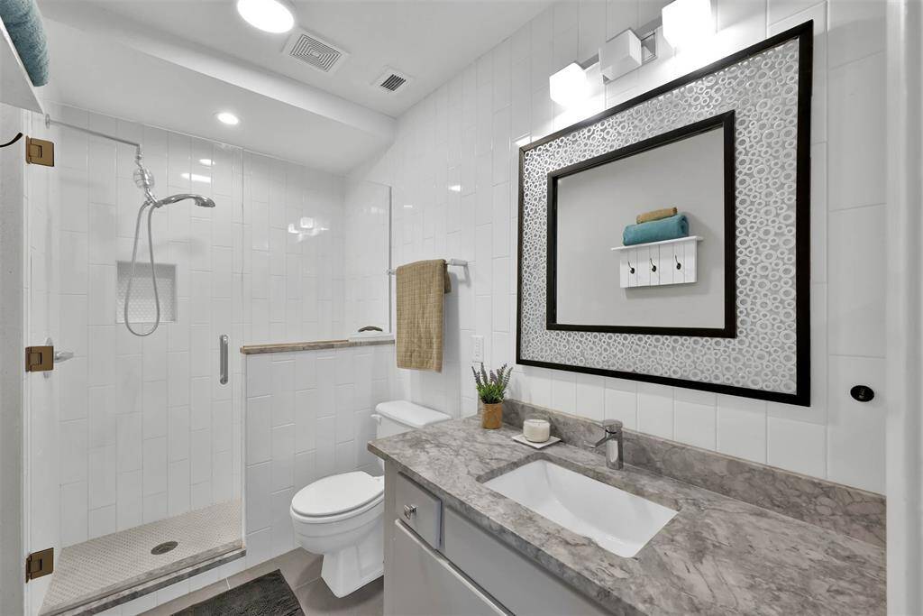 Primary bath with a large walk-in shower.