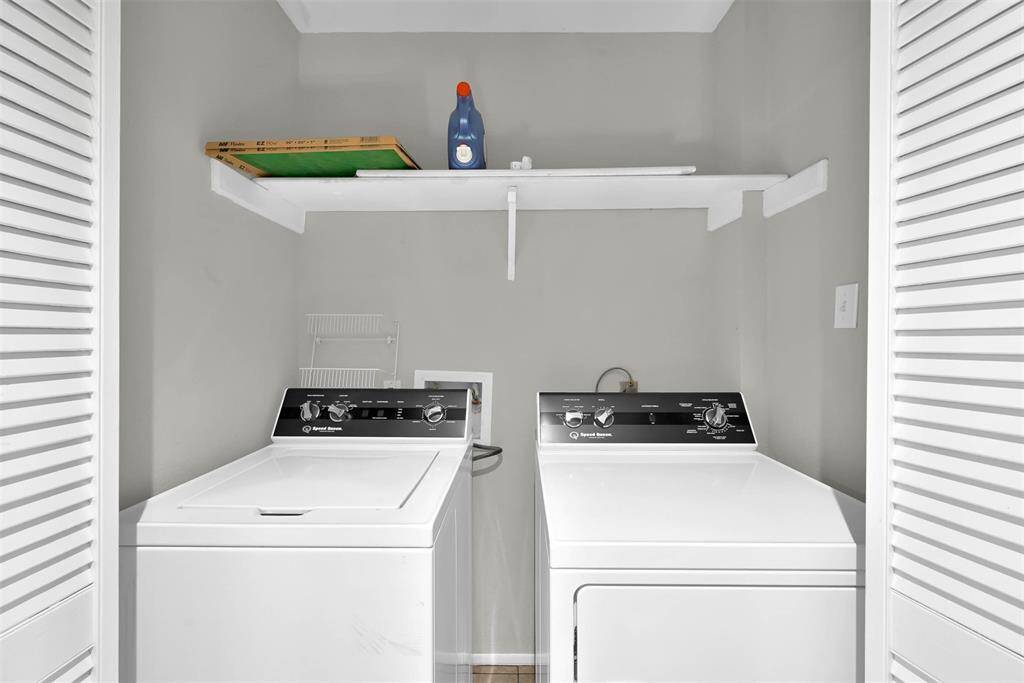 Laundry in hall between the bedrooms upstairs.