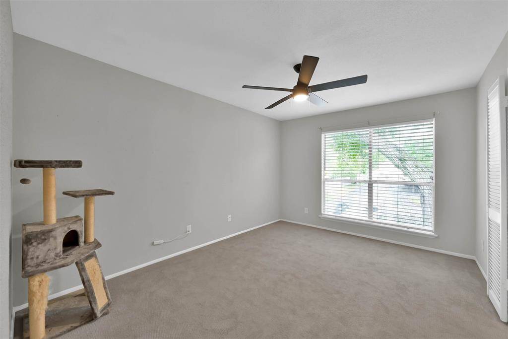Second bedroom with large window facing the front of the condo (Faces North)