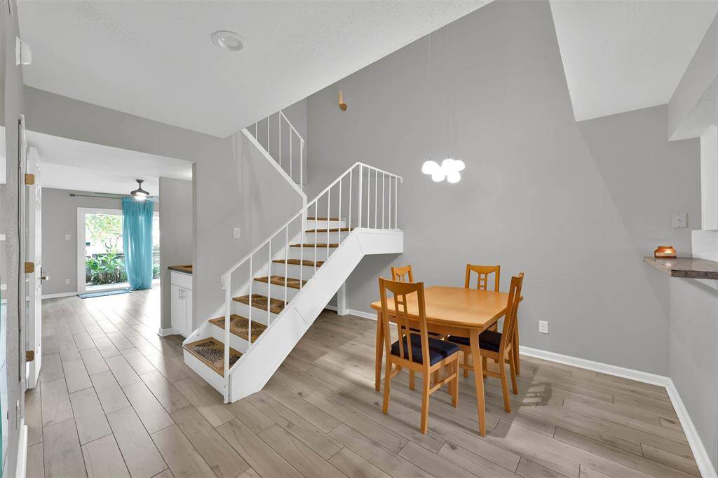 Dining area with storage under stairs