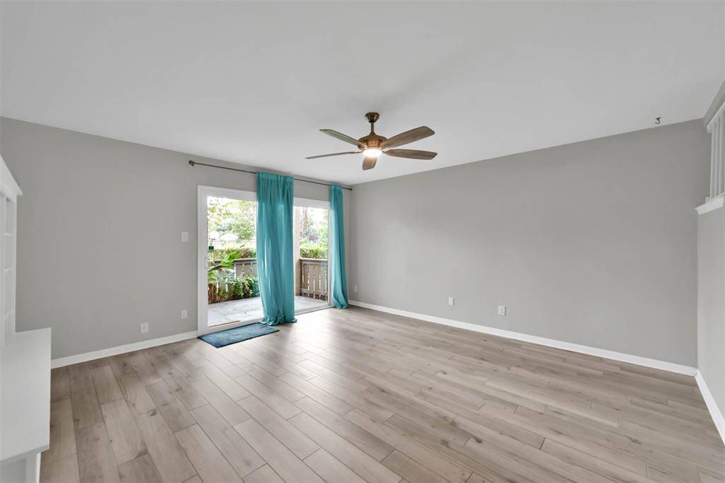 Living Room has a sliding door out to your patio which has a large closet for extra storage.