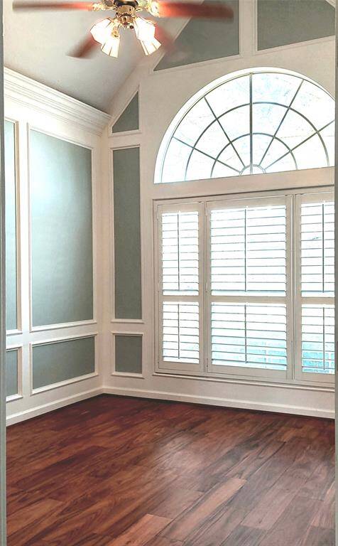 The office gives a luxurious feel with high ceilings, custom-painted walls, beautiful flooring, and natural light.