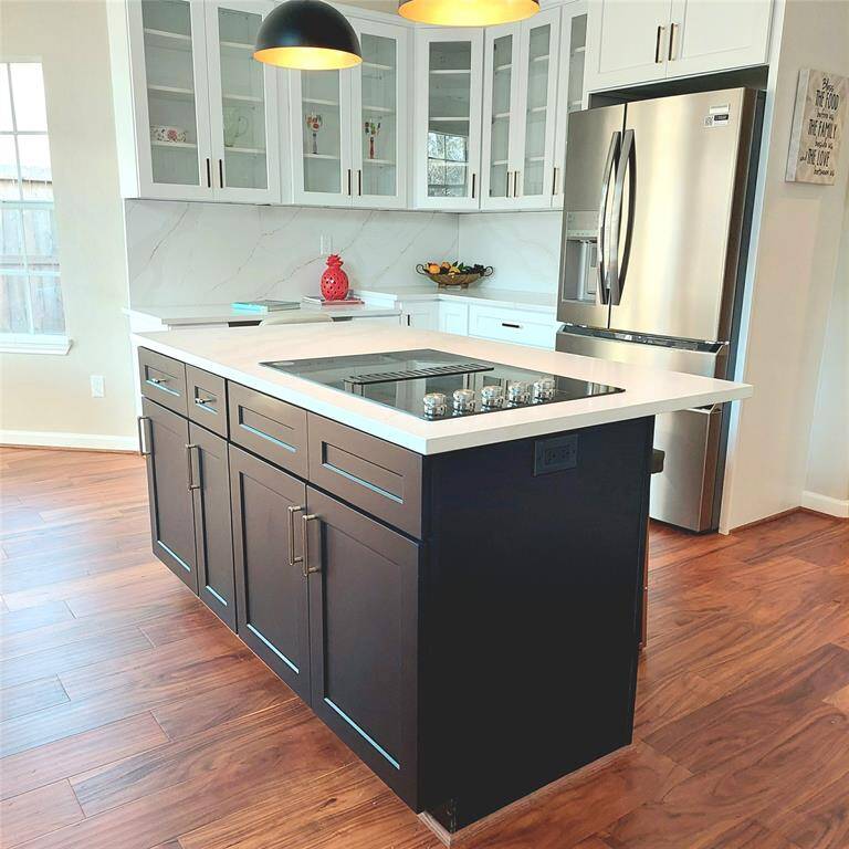 The appliances in this kitchen have never been used and are all upgraded. Come one, come all, and discover this up-to-date kitchen.