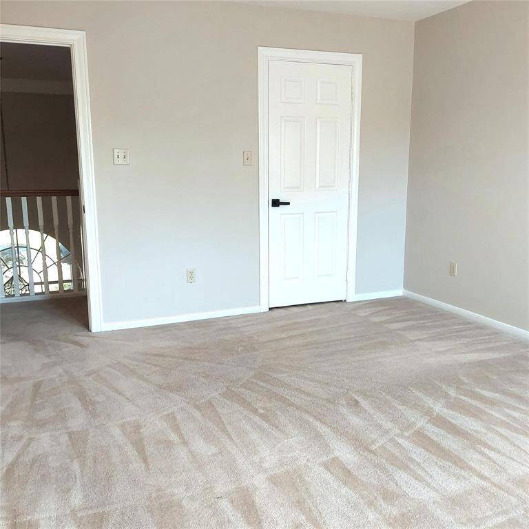 Check out this spacious, three-car garage with epoxy flooring and added extra storage with new cabinets.