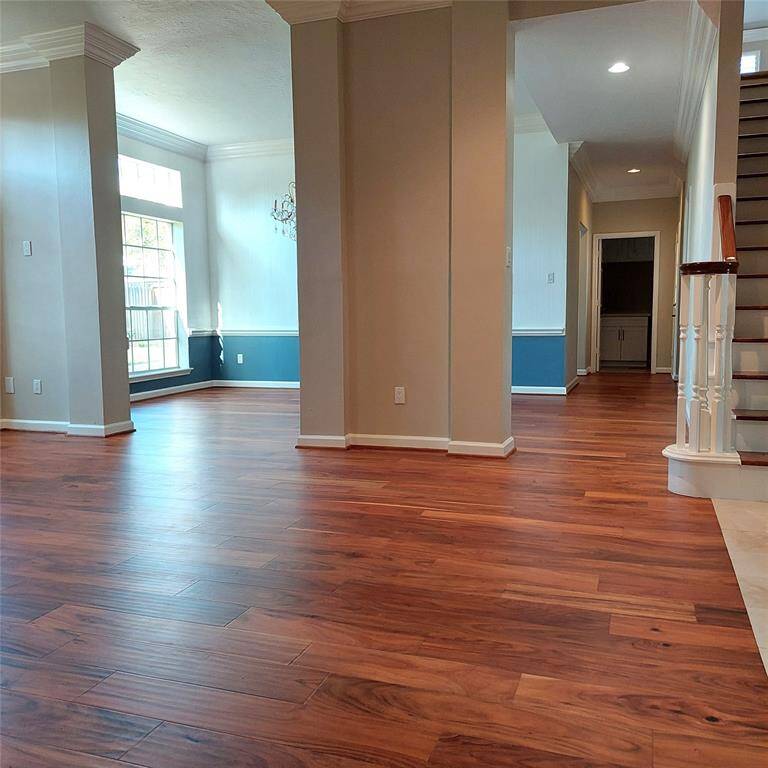 Another view of the formal dining room, from Family room, with the hall that leads to the kitchen, laundry room, garage entry, and exit door.