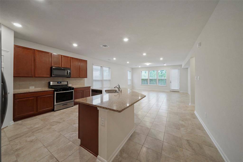 One side of Kitchen, LOTS granite counter space, and nice tall spacious 42 " cabinets.
