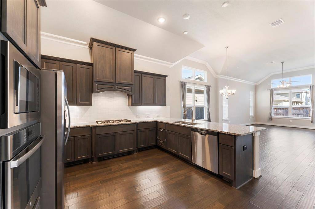 Kitchen includes stainless appliances and refrigerator included.