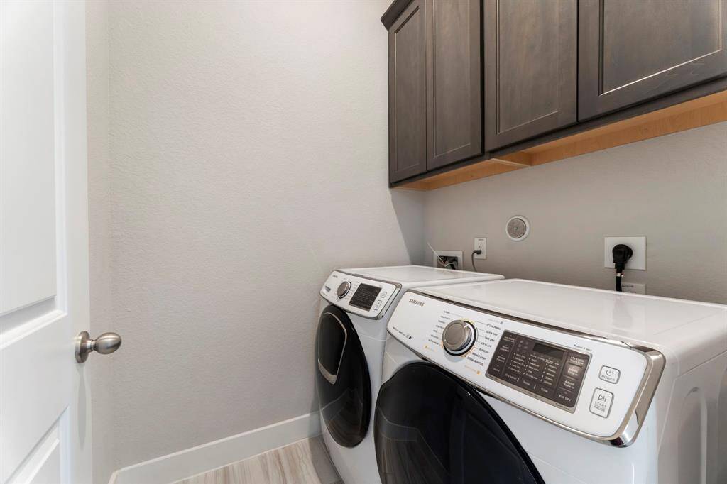 Laundry room includes washer & dryer.