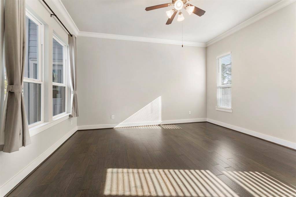 Primary bedroom situated in in back of the house offering privacy.