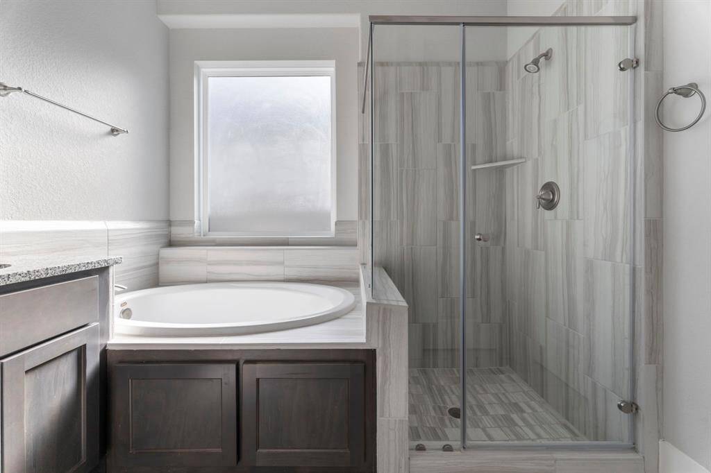 Separate tub and shower.