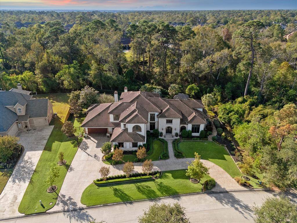 The property is on a quiet cul de sac backing a greenbelt boasting a lush, wooded area, offering privacy and natural surroundings.