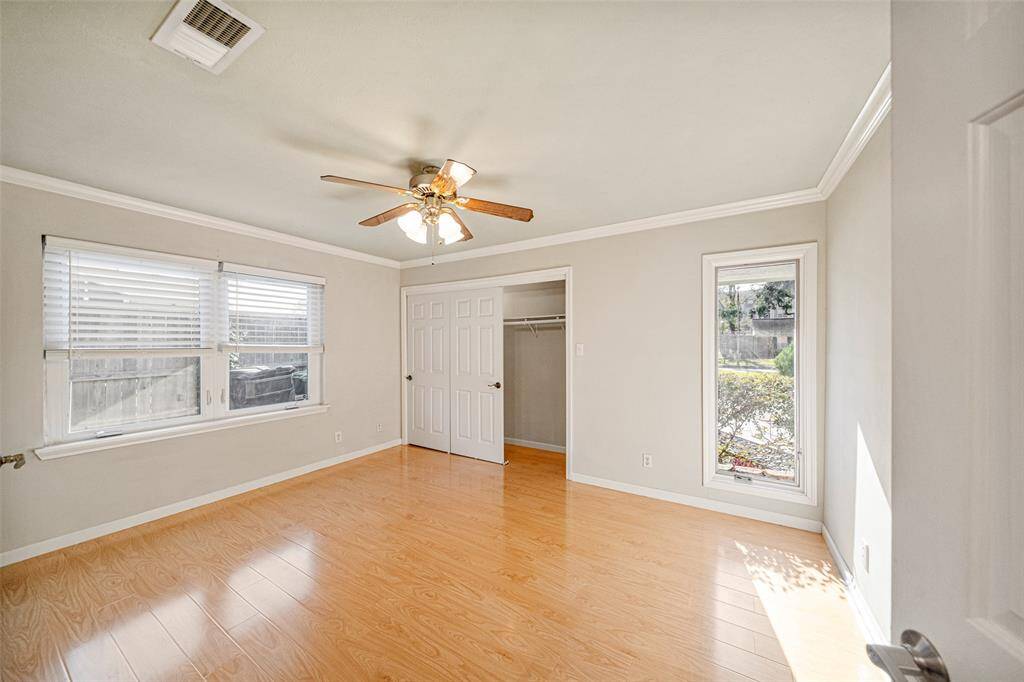 The last of the secondary bedrooms, this room also features two closets, ceiling fan and abundant natural light with views of the front lawn.