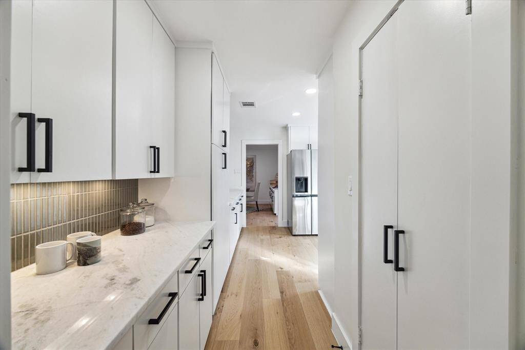 Large butler's pantry including walk-in pantry provide lots of storage space off the kitchen.