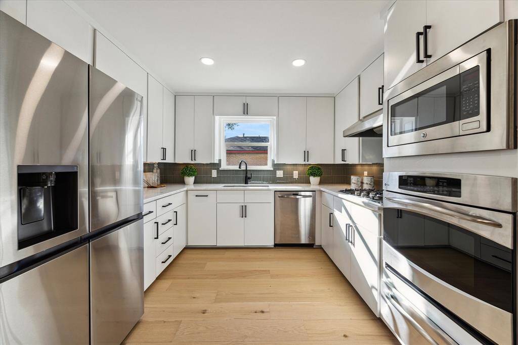 The kitchen includes all new appliances, cabinets, countertops and backsplash matching the contemporary modern design of the home.