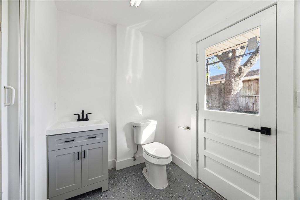 For the utmost in convenience, this half bath off of the garage is accessible from the pool and back yard as well.
