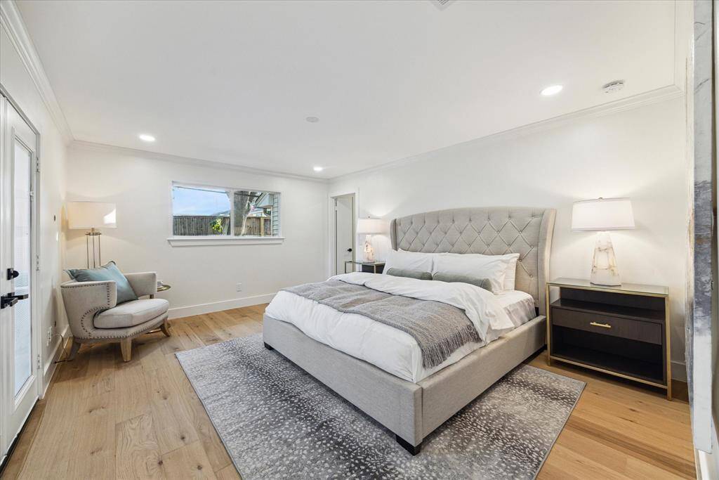 Large bright primary suite with ensuite bath, walk-in closet and separate vanity area.