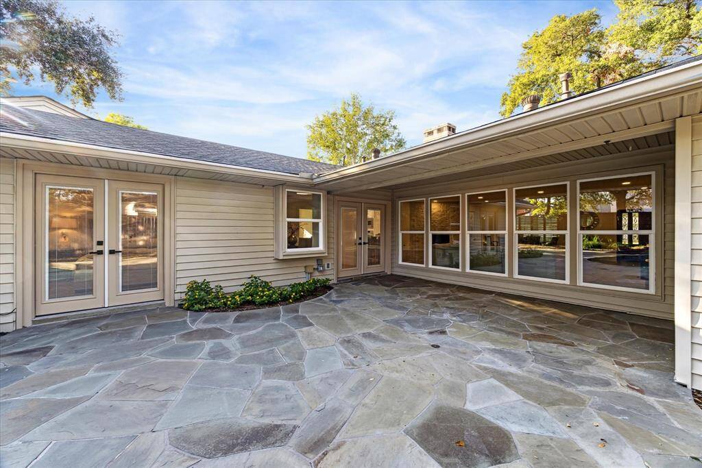 Covered patio off the kitchen would be an ideal location for an outdoor dining area.
