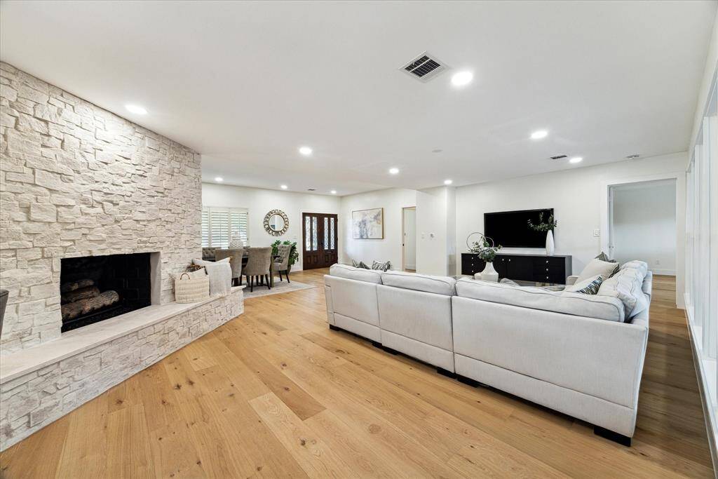 This majestic stone fireplace brings a warm coziness to the entire home and is the focal point of the living room.