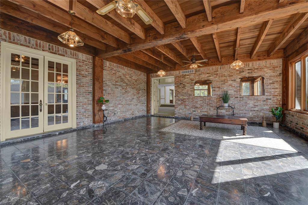 Large enclosed patio connects to both living rooms.