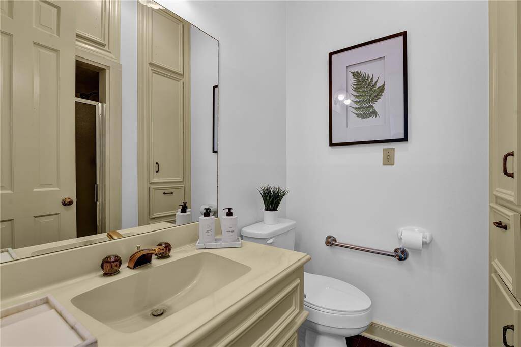 Full Bath located in Rear of Home with high ceilings.