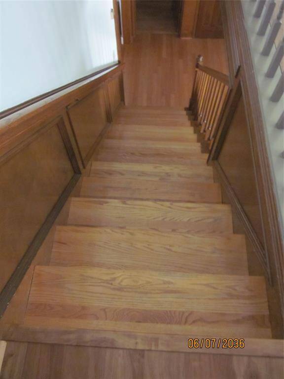 Charming all wood staircase leading upstairs