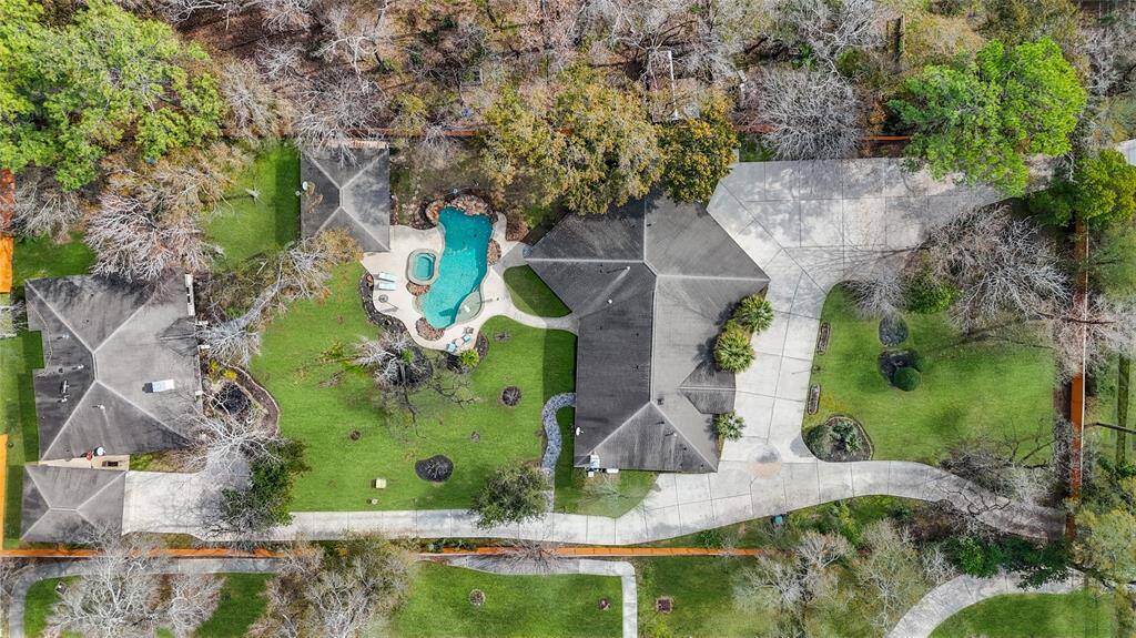 The highlight of this outdoor-centric property is the gorgeous pool which is currently shared by the two homes. Large enough for real relaxation or pool parties, this one has an enchanting waterfall feature, as well as a large spa, and even a "beach" area to sit in the shallows under an umbrella!