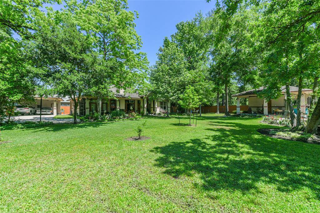 Completely separate and way across the expansive garden areas sits this second home which would be ideal as a multi-generational family situation.  You could live in the front home and have parents, grandparents, or whomever live in this back home.  You are together yet separate within this fenced and gated compound!
