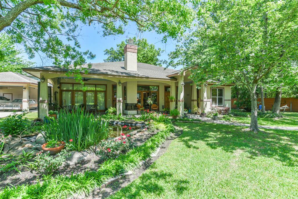 At the rear of the property is this equally fabulous second home of approximately 2,334 sqft.  It is a two bedroom with two and one half bathrooms.  It has high ceilings throughout and is a charming home.  Both homes were built at the same time by the same builder.  Note, the pretty pond area in front with the flowering and lush plantings.  I cannot express how very peaceful, and quiet it is on this property especially in the evenings.  It is truly an oasis within our bustling city.
