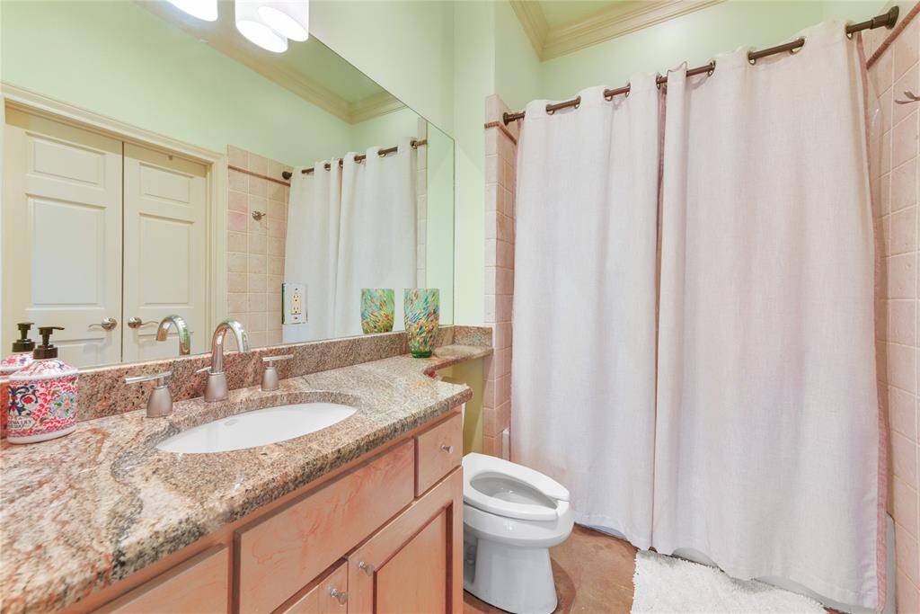 The second bedroom has this lovely en-suite bath attached with granite topped vanity and single sink plus a tub & shower combination bath.