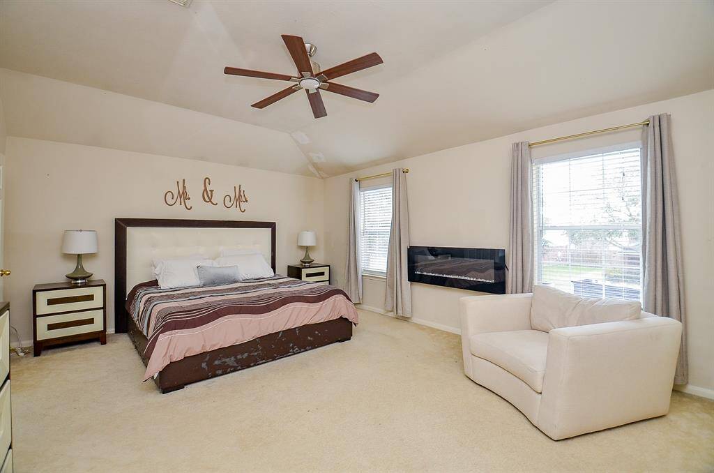 The primary bedroom exudes a sense of modern elegance and comfort.