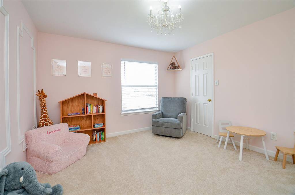 A large window allows natural light to flood the room.