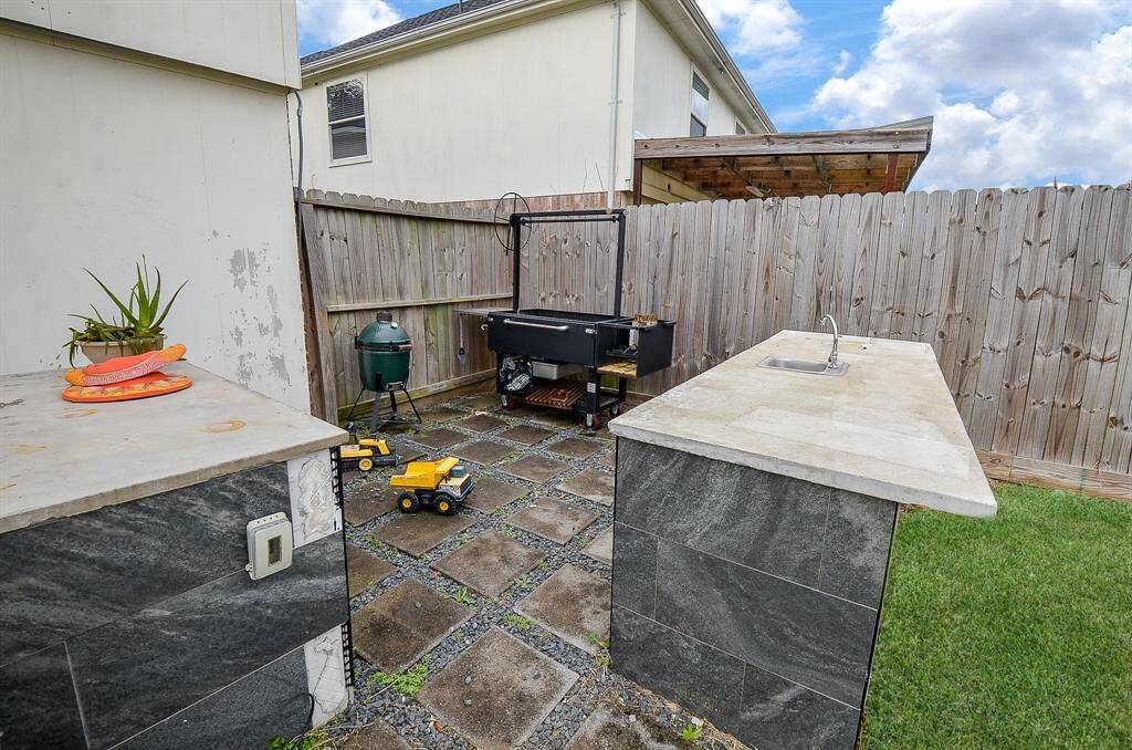 This backyard is the perfect setting for hosting gatherings or enjoying family time.