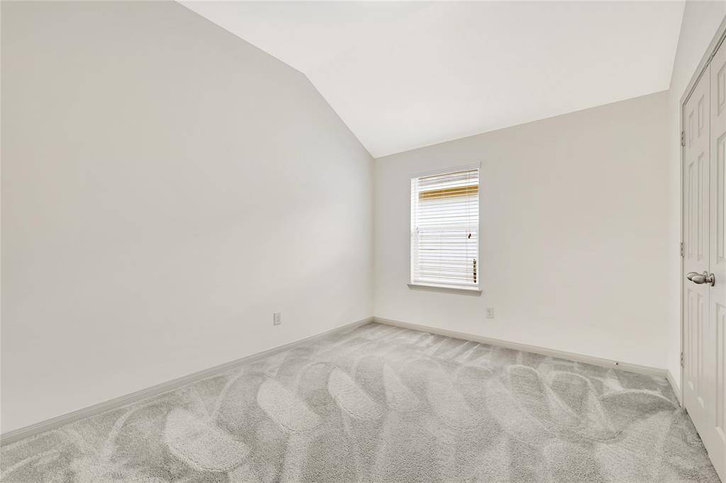 One of two additional bedrooms can be used for an office or work-out room.