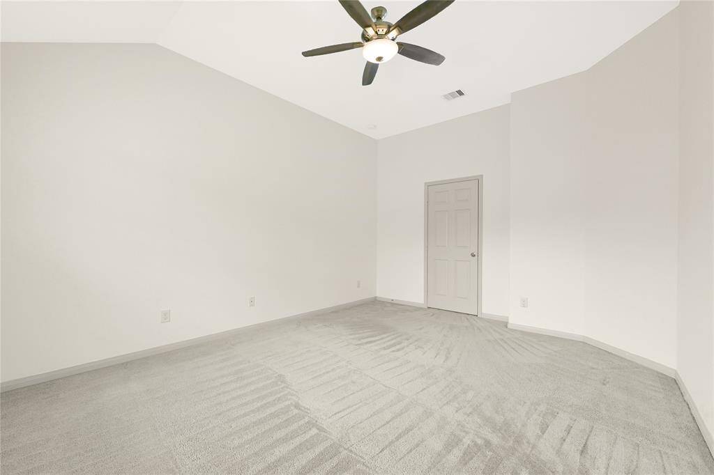 Another bedroom is nicely sized for guests and is towards the front of the home for added privacy from the primary bedroom.