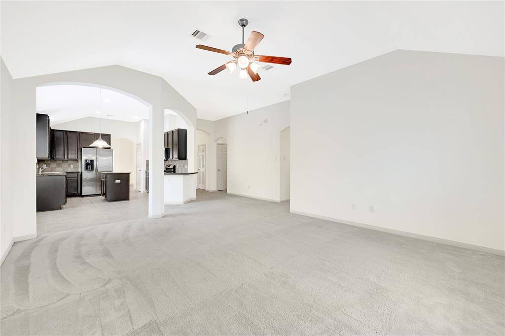 This home is well-designed with its open concept and lovely arches.