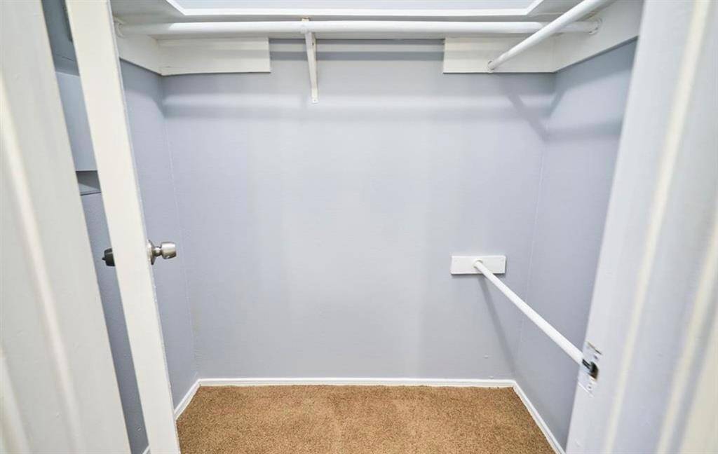 First of two closets in master bedroom