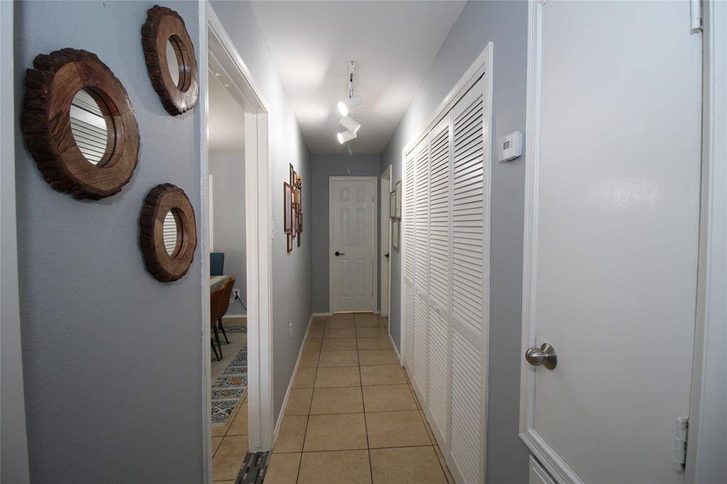 Hallway leading to the rooms and laundry
