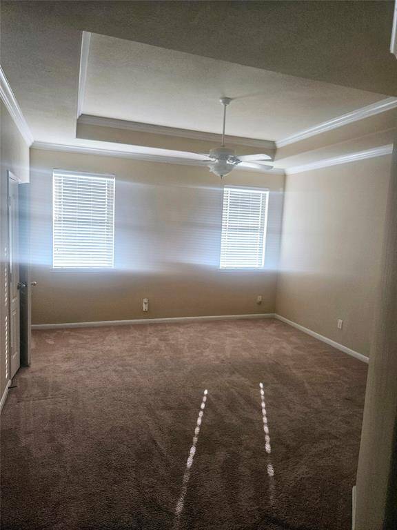 Spacious Master Bedroom with Crown Molding