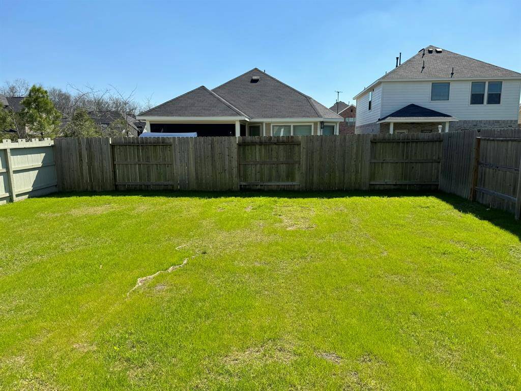 Home features a large covered back patio.